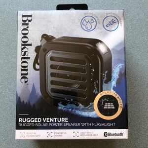 NIB Brookstone Rugged Venture Rugged Solar Power Speaker With Flashlight